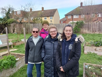 Clayburn Community Garden residents with Maya from the Trust