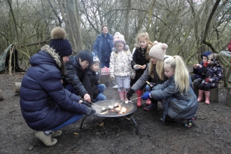 children around campfire