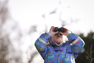 Boy with binoculars