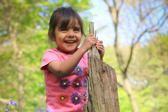 Watch child with bluebells