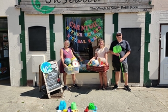 Coastal Ranger Adam stands beside owners of Unsealed in Clacton with collected plastic toys 