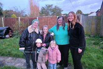 Maldon OWLS smile for photo in the garden