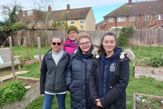 Clayburn Community Garden residents with Maya from the Trust