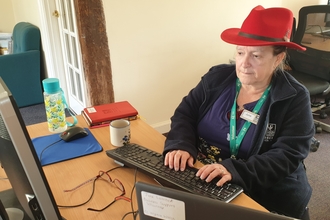 Volunteer June Lambert at Abbotts Hall Farm reception 