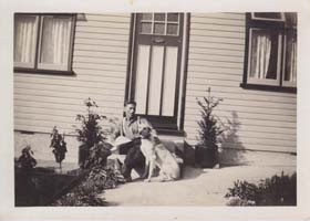 Frederick Mills outside The Haven with the family dog